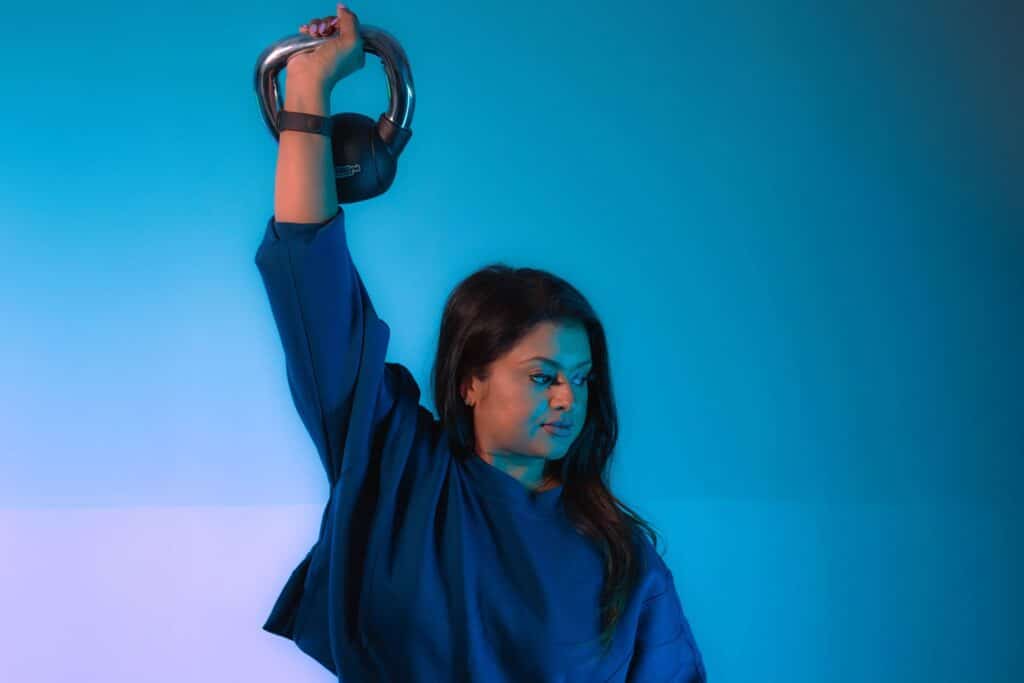Woman exercising with kettlebell